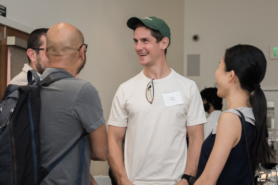 Robin Choy talking with guests at a CTO Fund event